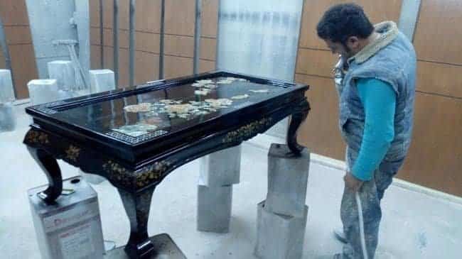 Refinished center coffee table with custom stain and polished woodgrain