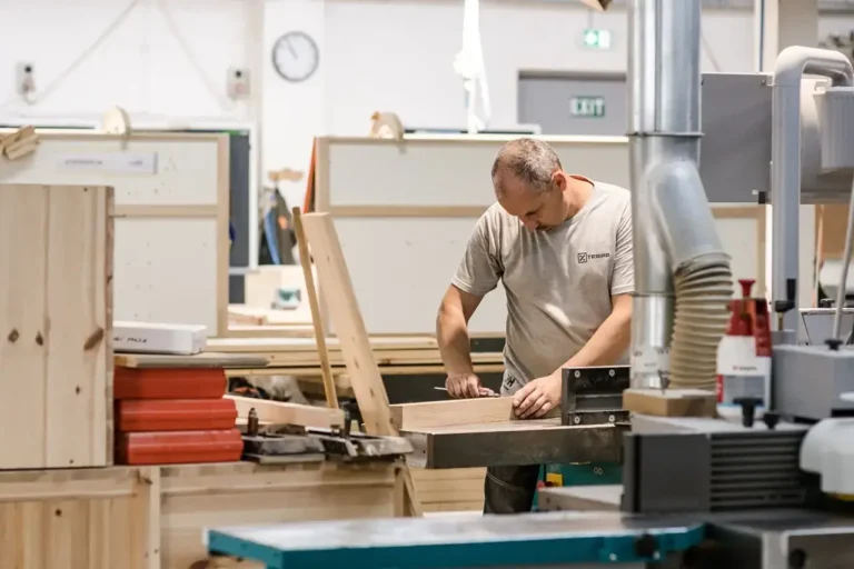 Team member reviewing design specs for furniture build