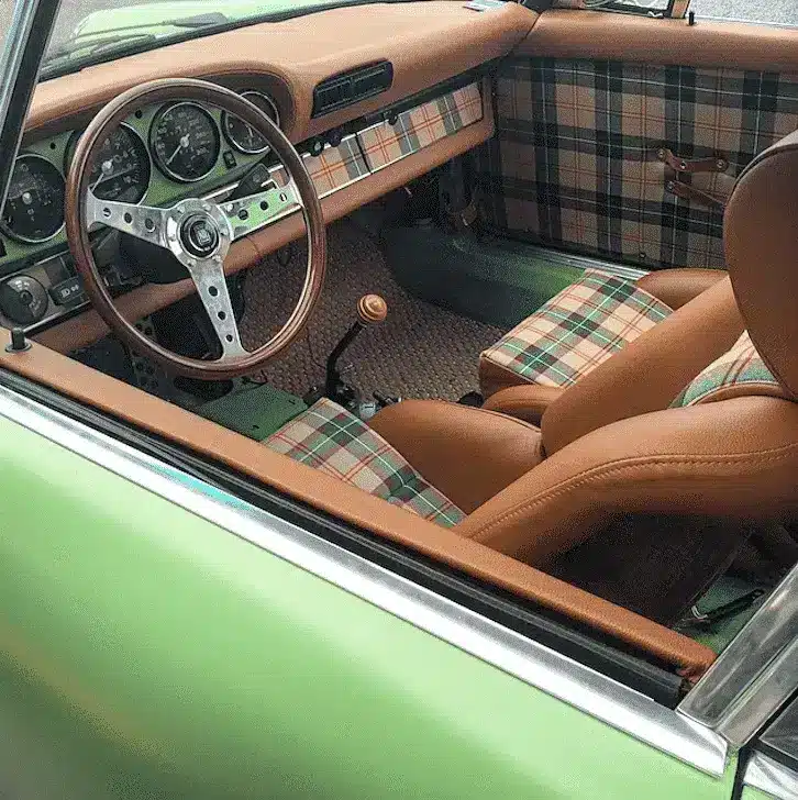Vintage convertible interior restored with custom leather seats and stitched trim