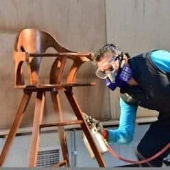 Finishing shop at First Class Upholstery — custom furniture detailing in progress