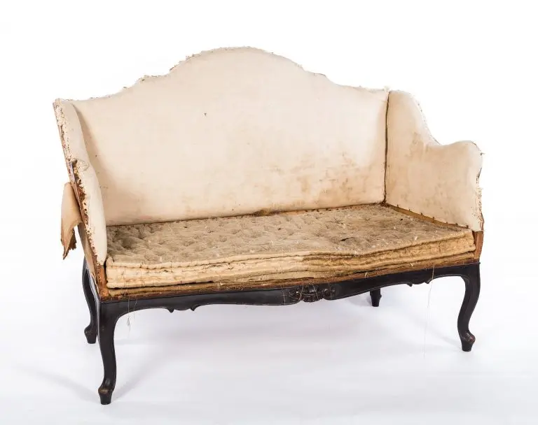 Close-up of spring system repair inside vintage settee