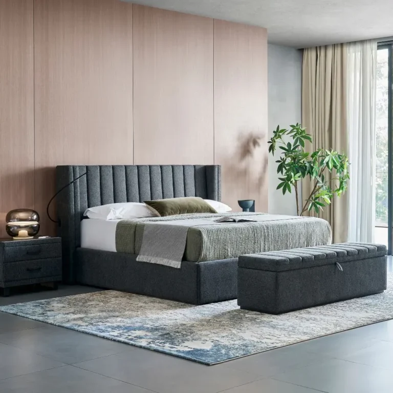 Upholstered bed base with reinforced corners and matched piping