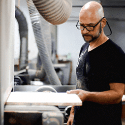 carpentry shop at First Class mastercraft — custom furniture detailing in progress