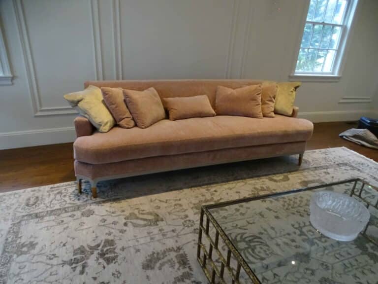 Luxury baker sofa restoration and structural repair by first class mastercraft, showcasing precision fabric tailoring and artisan upholstery for highvalue classic collections.